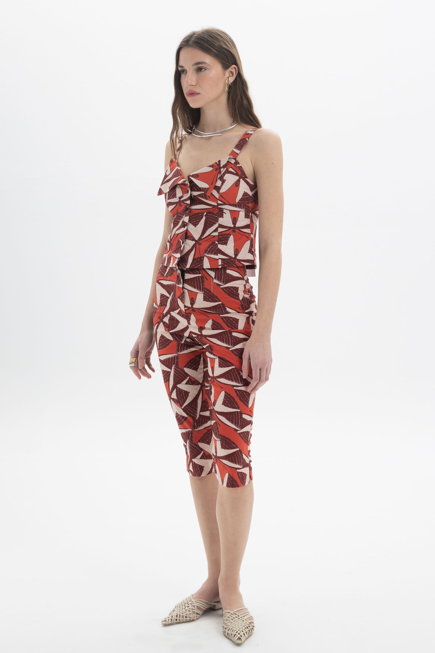 Button-Front Cami Top worn by a model, featuring a bold graphic print and a fitted design.