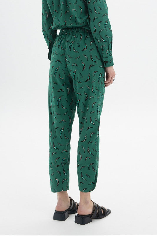 Cropped Drawstring Trousers showing back view with chili pepper print and elastic waist.