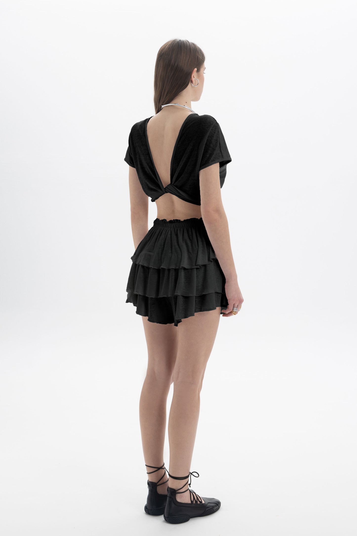 Black and Black B&B x F Twist Back Crop Top, front view showing the fitted black crop top with twist back detail.