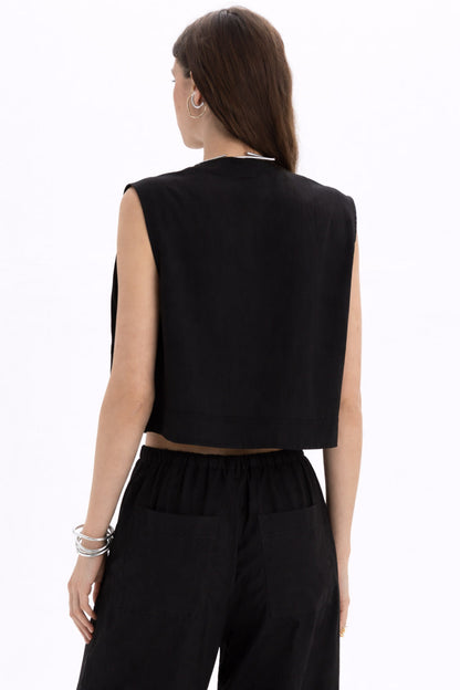 Back view of Pleated Cropped Sleeveless Top in black, showcasing modern cropped design and minimalist style.