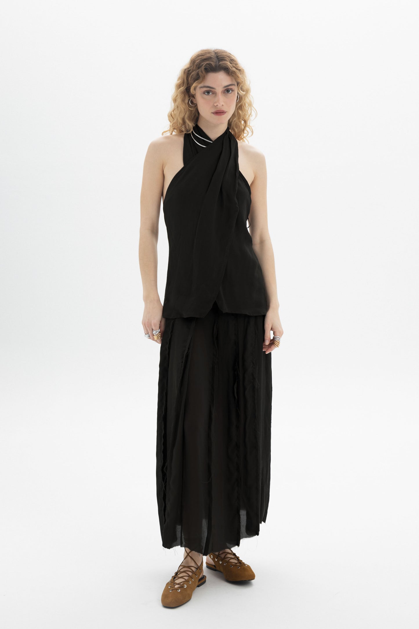 Model wearing a Draped Halter Top with softly draped neckline and fluid silhouette.
