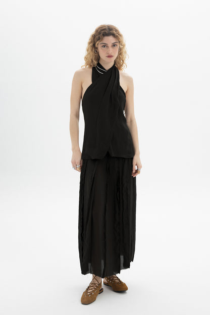 Model wearing a Draped Halter Top with softly draped neckline and fluid silhouette.