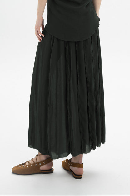 Sheer Layered Maxi Skirt showcases a relaxed silhouette with layered construction and a flowy sheer outer layer.