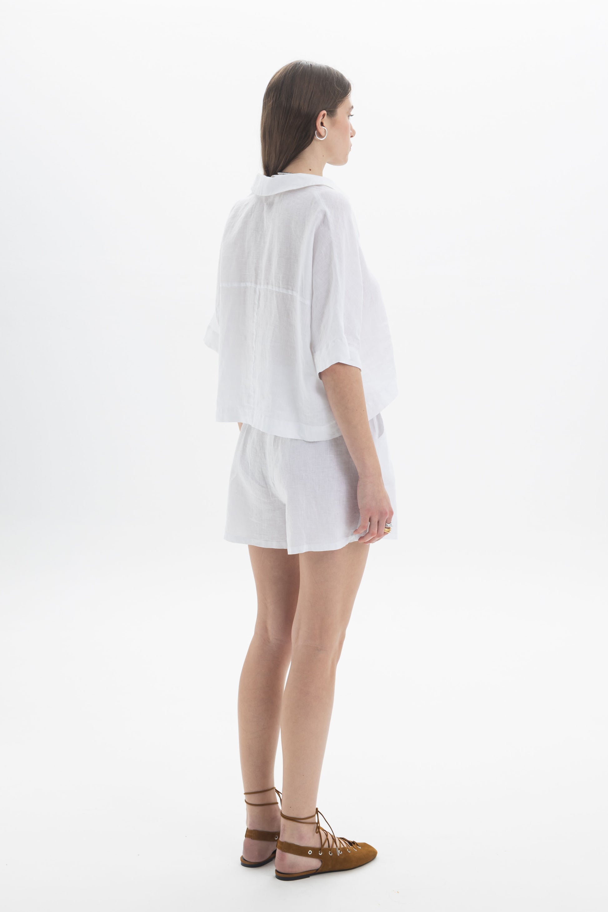 Linen Polo Top featuring a lightweight cropped design with a relaxed silhouette and soft polo-style collar.