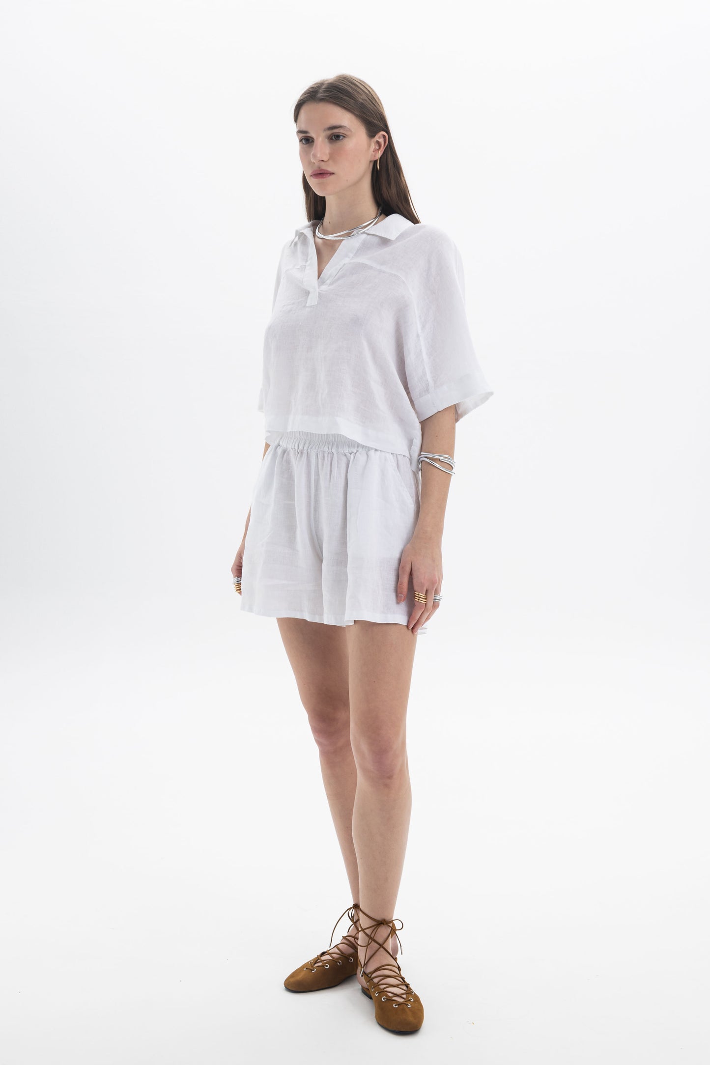 Model wearing Linen Shorts with a relaxed fit and elasticated waistband, paired with a matching linen top.