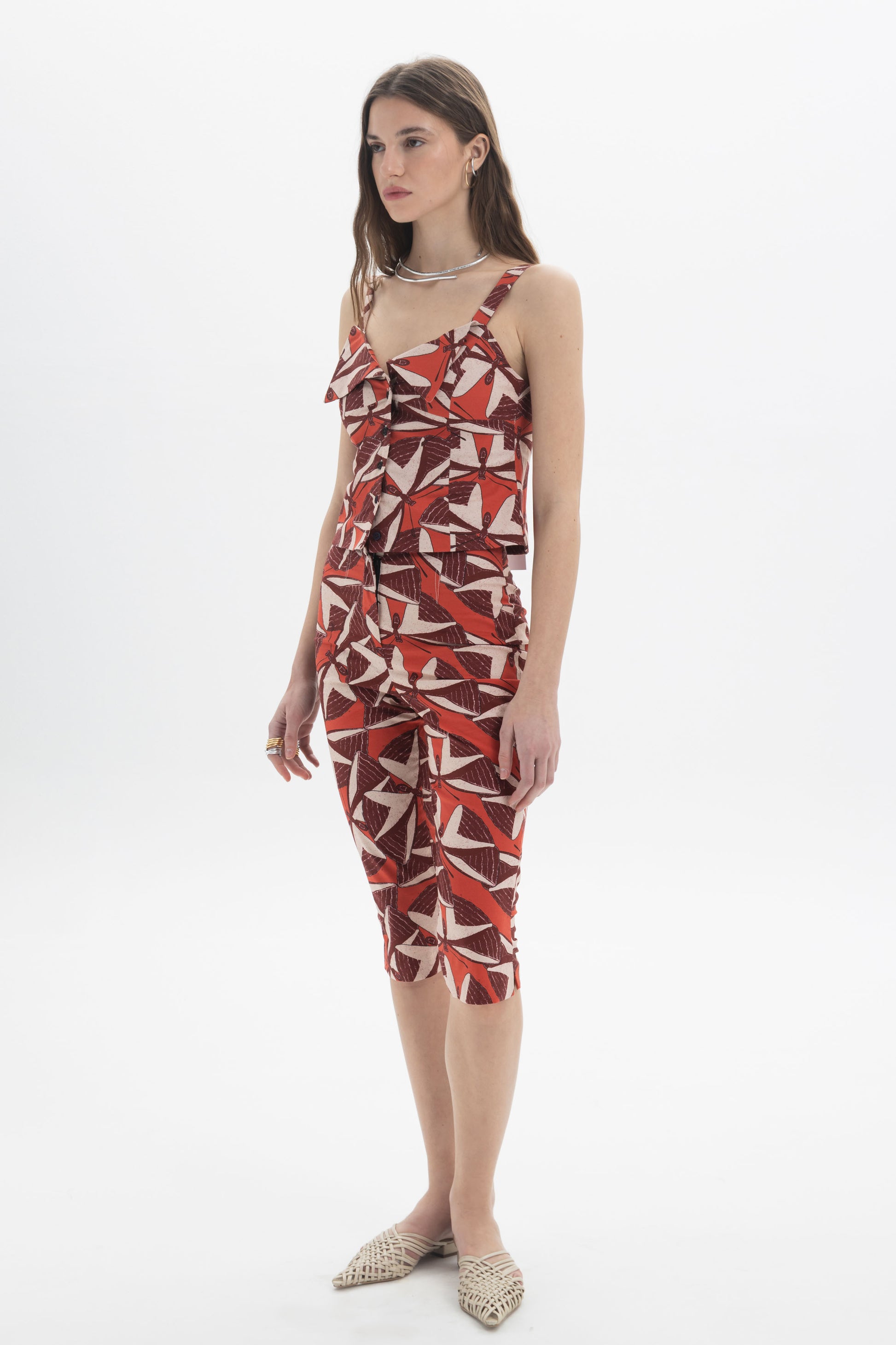 Button-Front Cami Top worn by a model, featuring a bold graphic print and a fitted design.