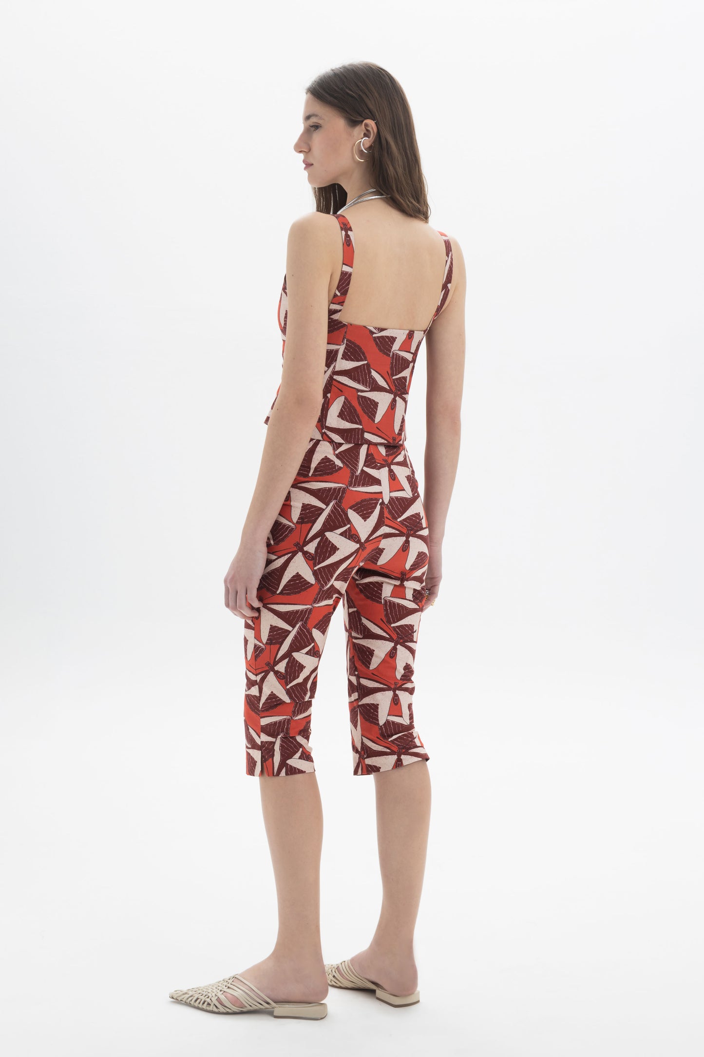 Button-Front Cami Top worn by a model showcasing the back design and bold graphic print.