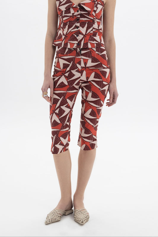 Model wearing Printed Capri Trousers with a fitted silhouette and graphic print for a modern look.