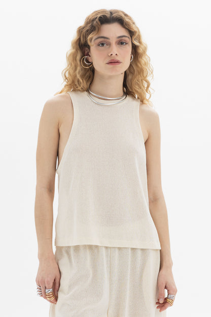 Sleeveless Textured Top in lightweight fabric with a round neckline and relaxed silhouette.