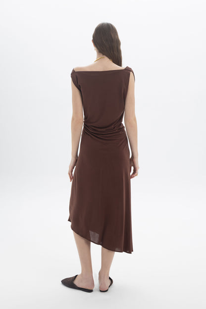 Back view of a model wearing an Asymmetric Draped Midi Dress in brown with a relaxed draped silhouette.