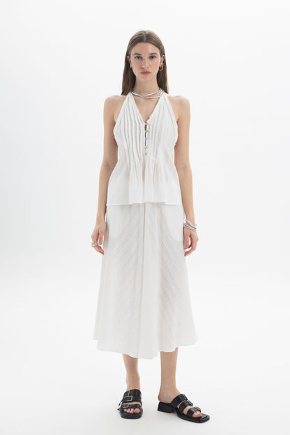 Textured Midi A-Line Skirt worn with a stylish white halter top, showcasing a soft silhouette and fluid movement.