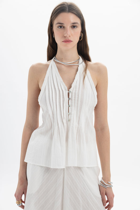 Lightweight Pleated Halter Peplum Top with vertical pleats and tied back, perfect for skirts or tailored trousers.