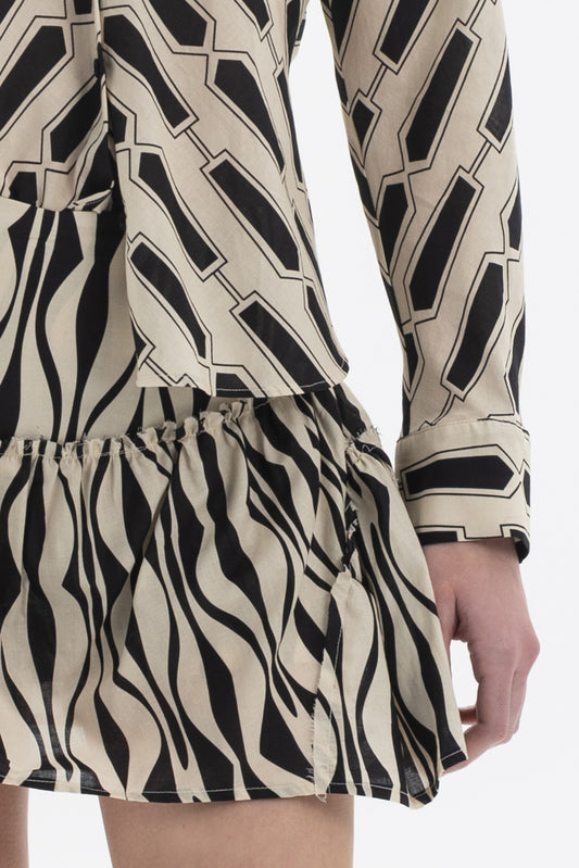 Detail of Ruffle Hem Skort featuring zebra-inspired print and gathered ruffle hem for a stylish layered look.