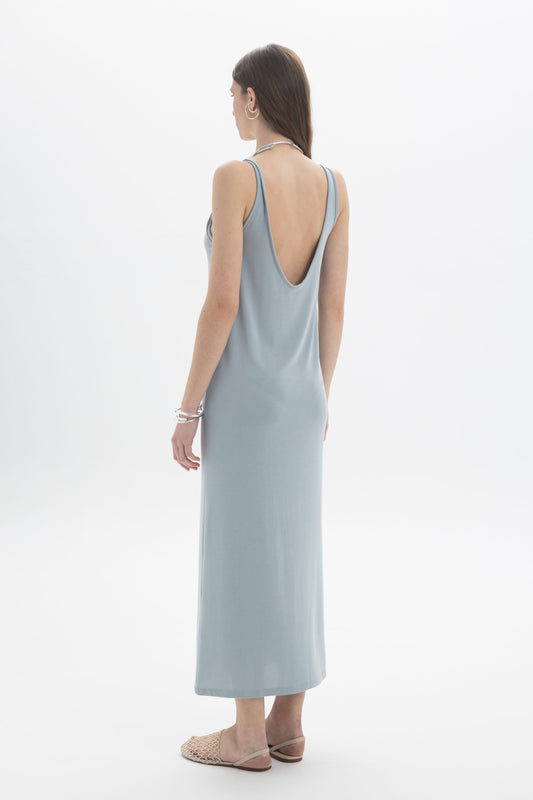 Open Back Tank Dress displayed from the back, showcasing its deep open back and soft midi length in a light blue fabric.