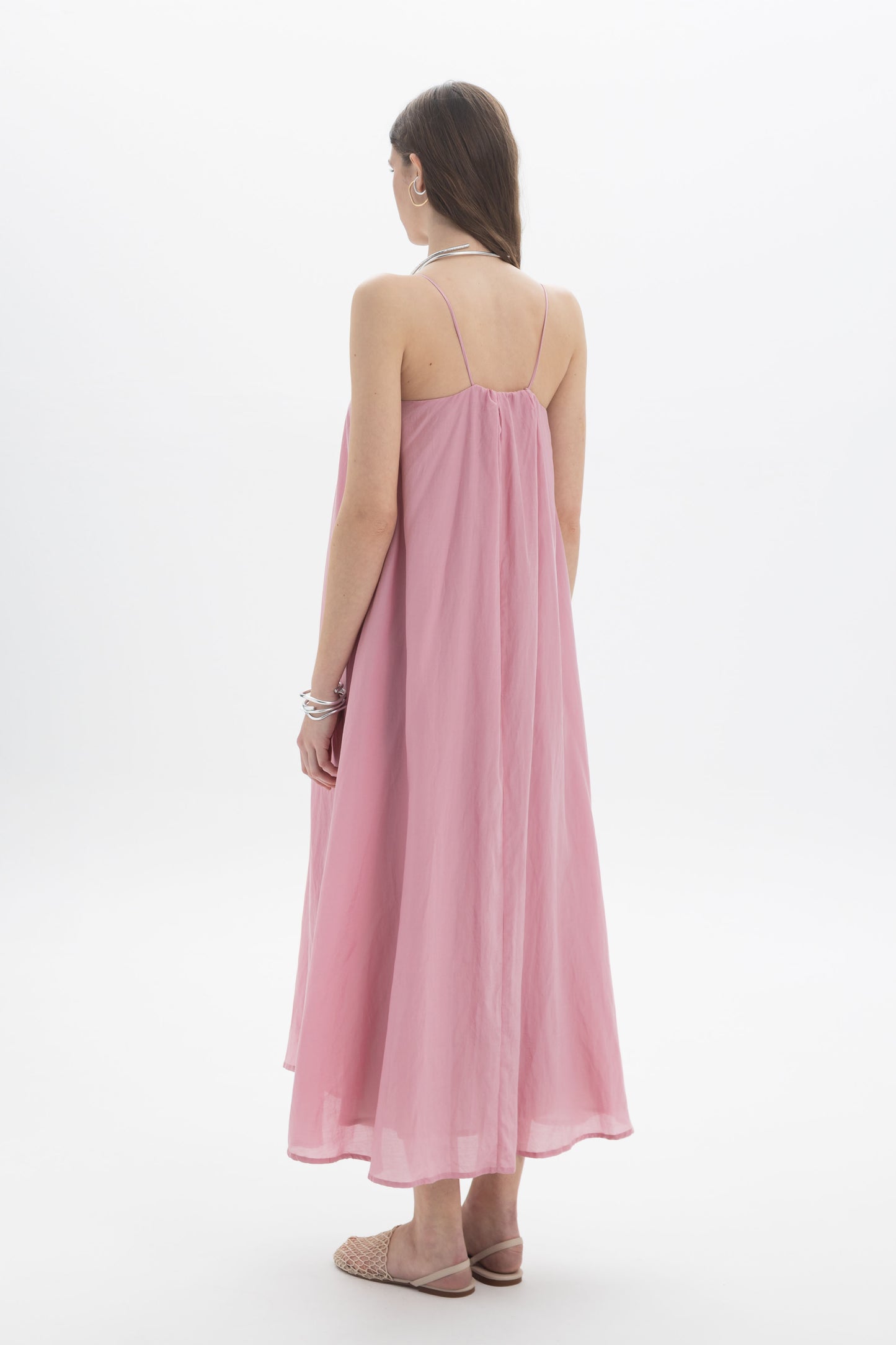 Back view of Gathered Strap Midi Dress in soft pink, showcasing delicate straps and flowing silhouette.