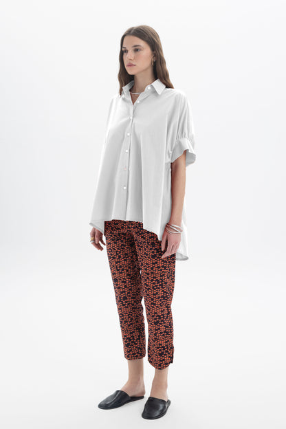 Black and Black oversized short sleeve button-up shirt with a relaxed fit, displayed on a mannequin.