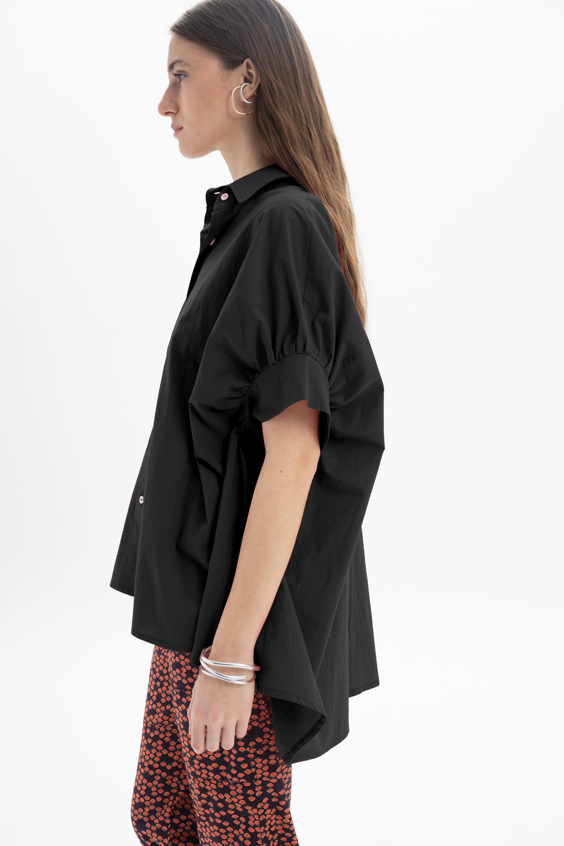 Black and Black oversized short sleeve button-up shirt with a relaxed fit, featuring a classic collar and button closure.