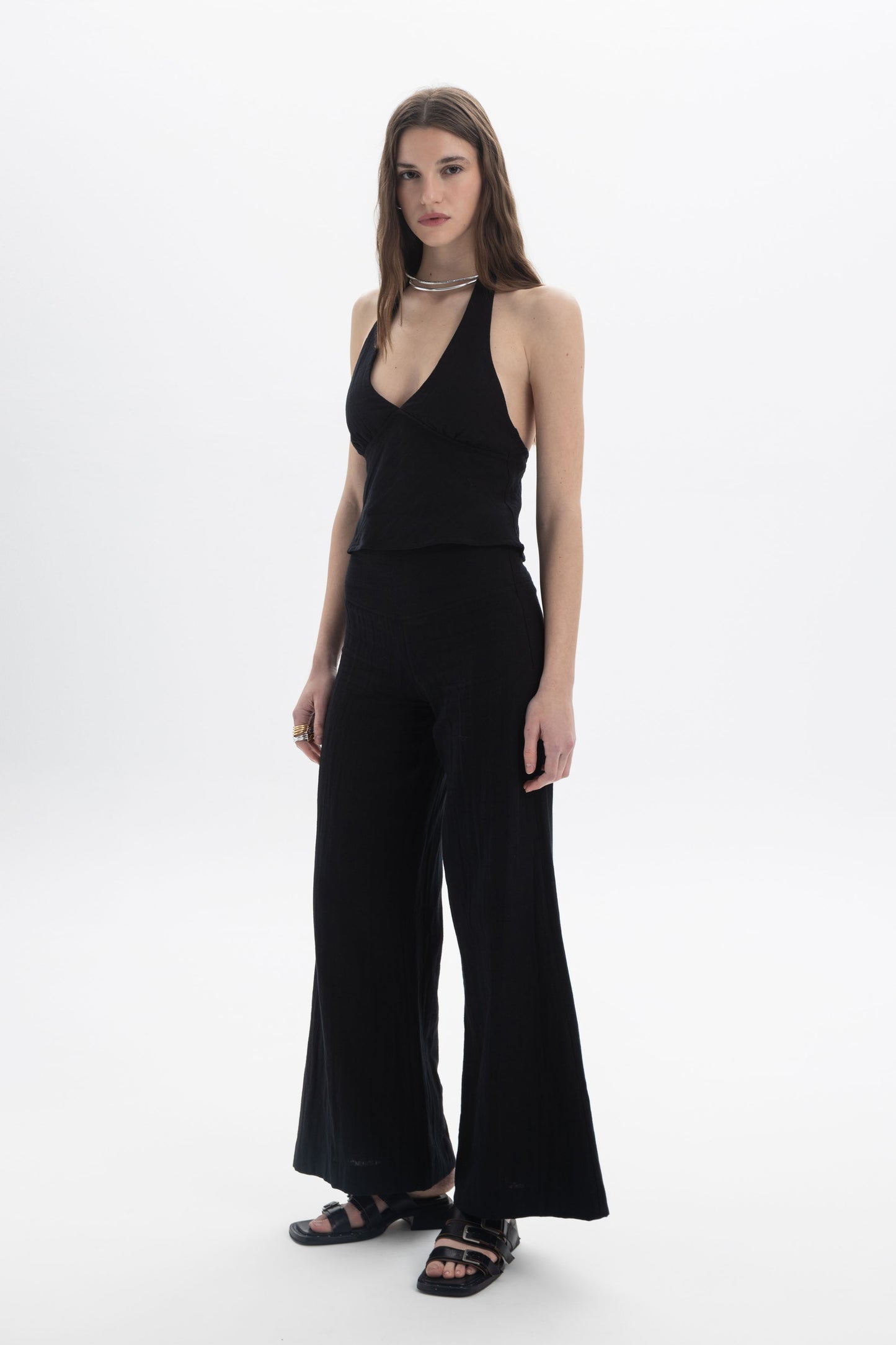 Halter Neck Fitted Top on model showcasing a deep V neckline and open back design.
