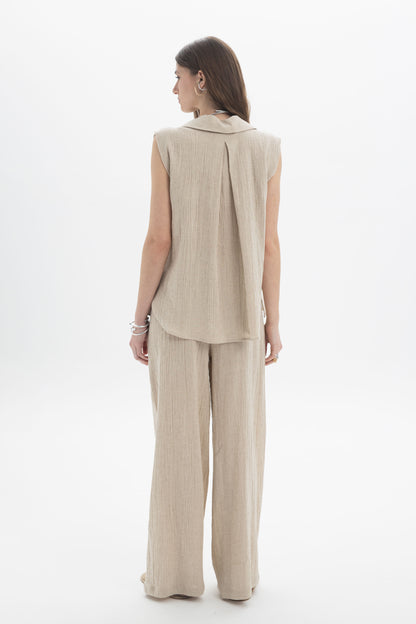 Sleeveless Textured Collar Blouse back view with soft collar neckline and loose fit in a light linen-cotton blend.