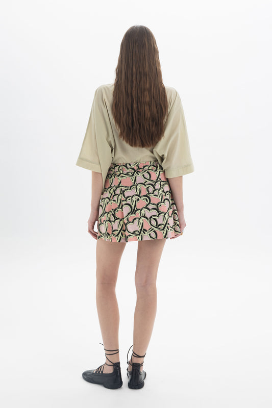 Model wearing a relaxed Elbow Length Shirt paired with a patterned skirt, showcasing effortless style and comfort.