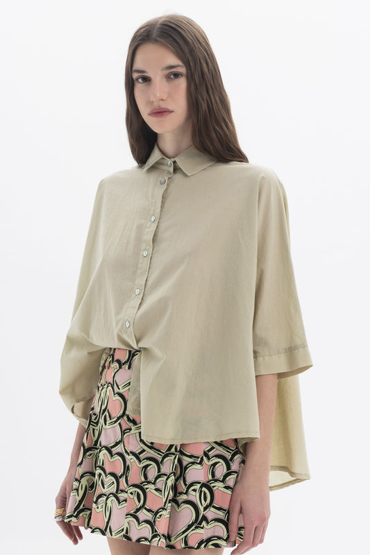 Elbow Length Shirt in beige with classic collar and oversized fit, paired with a patterned skirt.