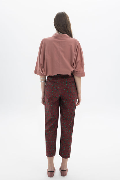 Woman wearing Regular Fit Cropped Pants with a relaxed fit and printed fabric, viewed from the back.