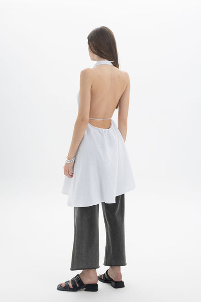 Back view of a model wearing a Longline Halter Top paired with wide-leg pants, showcasing the elegant silhouette.