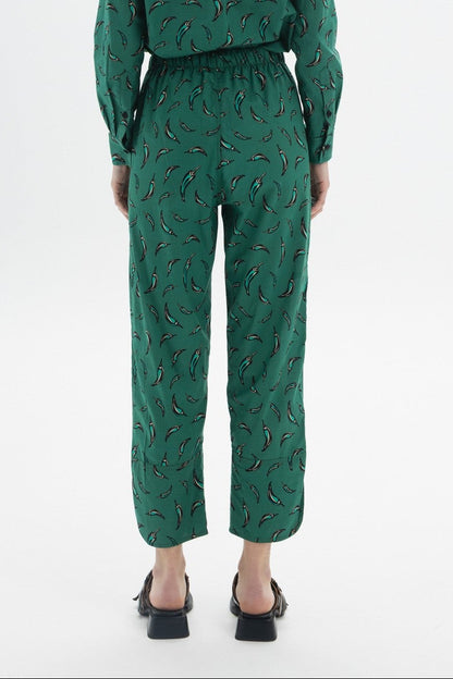 Cropped Drawstring Trousers featuring a green chili pepper print and an elastic waistband for comfort.