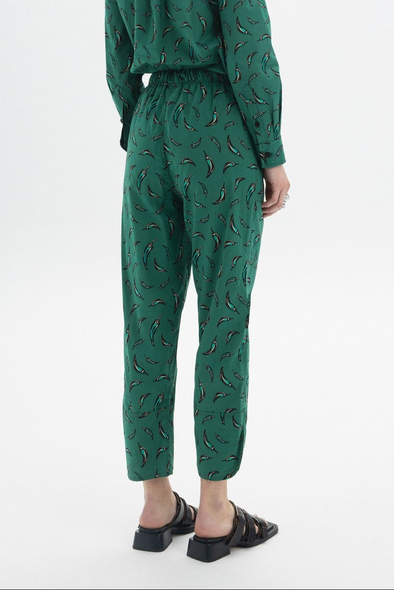 Cropped Drawstring Trousers showing back view with chili pepper print and elastic waist.