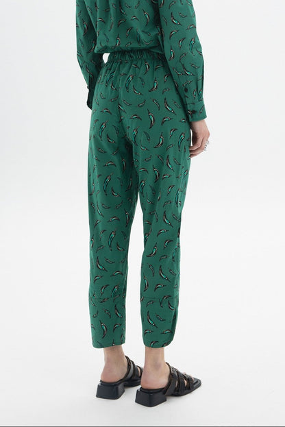 Cropped Drawstring Trousers showing back view with chili pepper print and elastic waist.