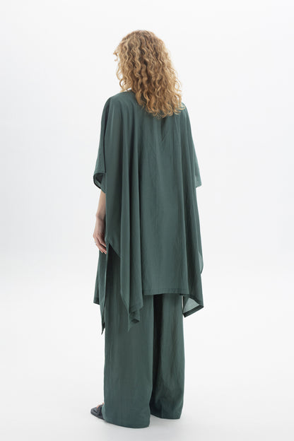 Back view of a model wearing a Sheer Kimono with relaxed drape and wide sleeves in green.