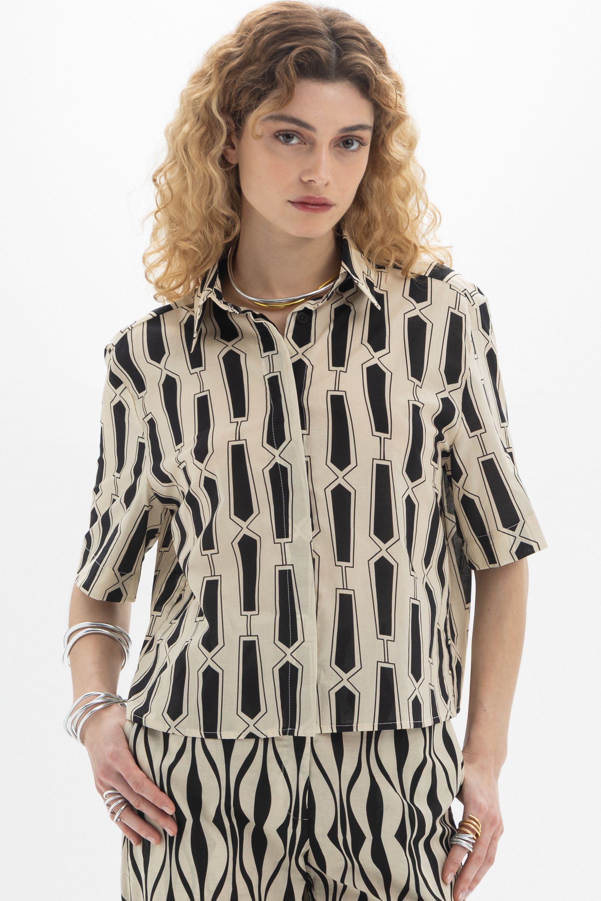 Short Sleeve Shirt featuring a classic collar and bold geometric print on a relaxed silhouette.