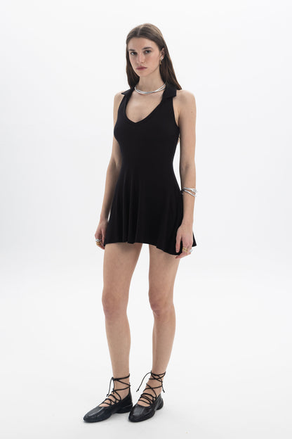 B&B x F Collared Mini Dress on a model showcasing its deep V neckline and flared skirt design.
