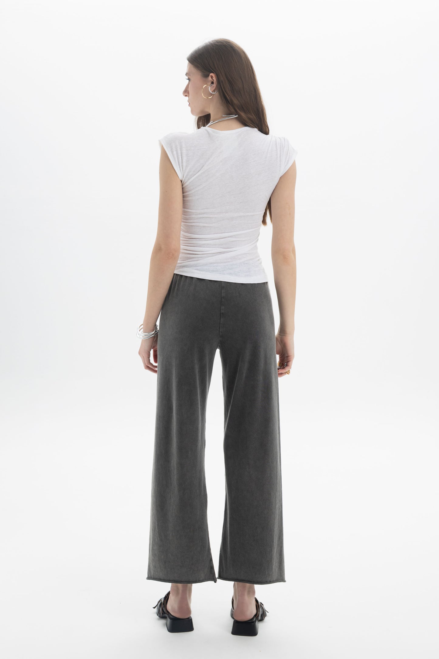 B&B x F Draped Cap Sleeve Top worn with wide-leg pants, showcasing a modern silhouette and soft draping.