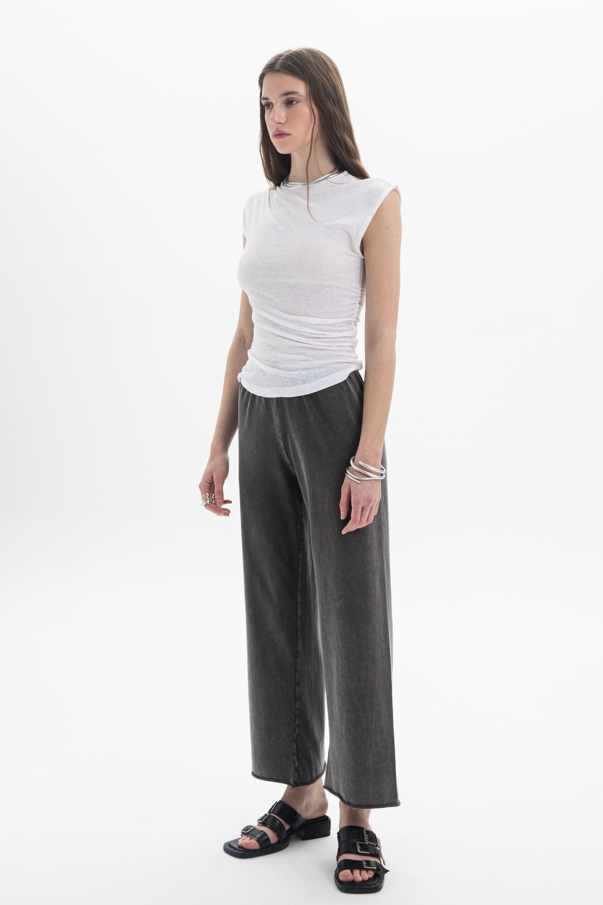 B&B x F Draped Cap Sleeve Top worn by model, featuring cap sleeves and soft draping, styled with wide-leg pants.