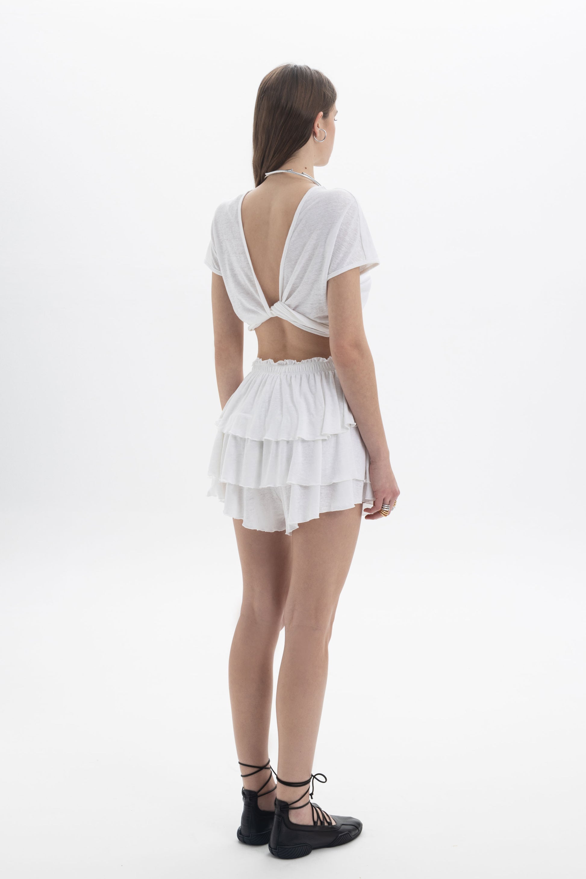 B&B x F Twist Back Crop Top worn with layered skirt, showcasing the back twisted detail and lightweight fabric.
