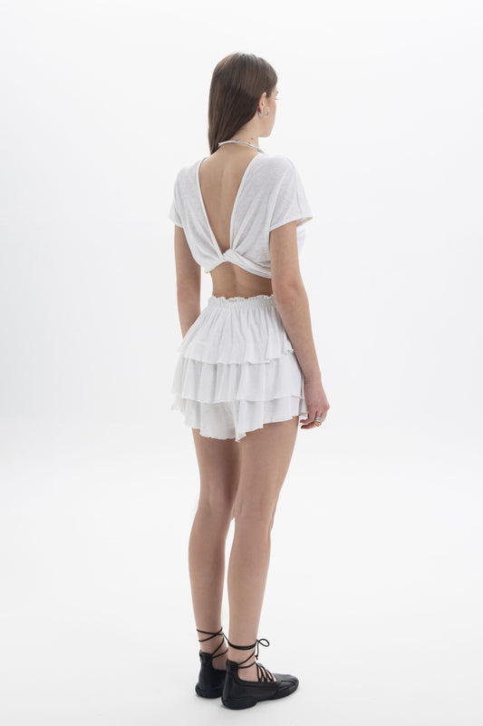 B&B x F Twist Back Crop Top worn with layered skirt, showcasing the back twisted detail and lightweight fabric.