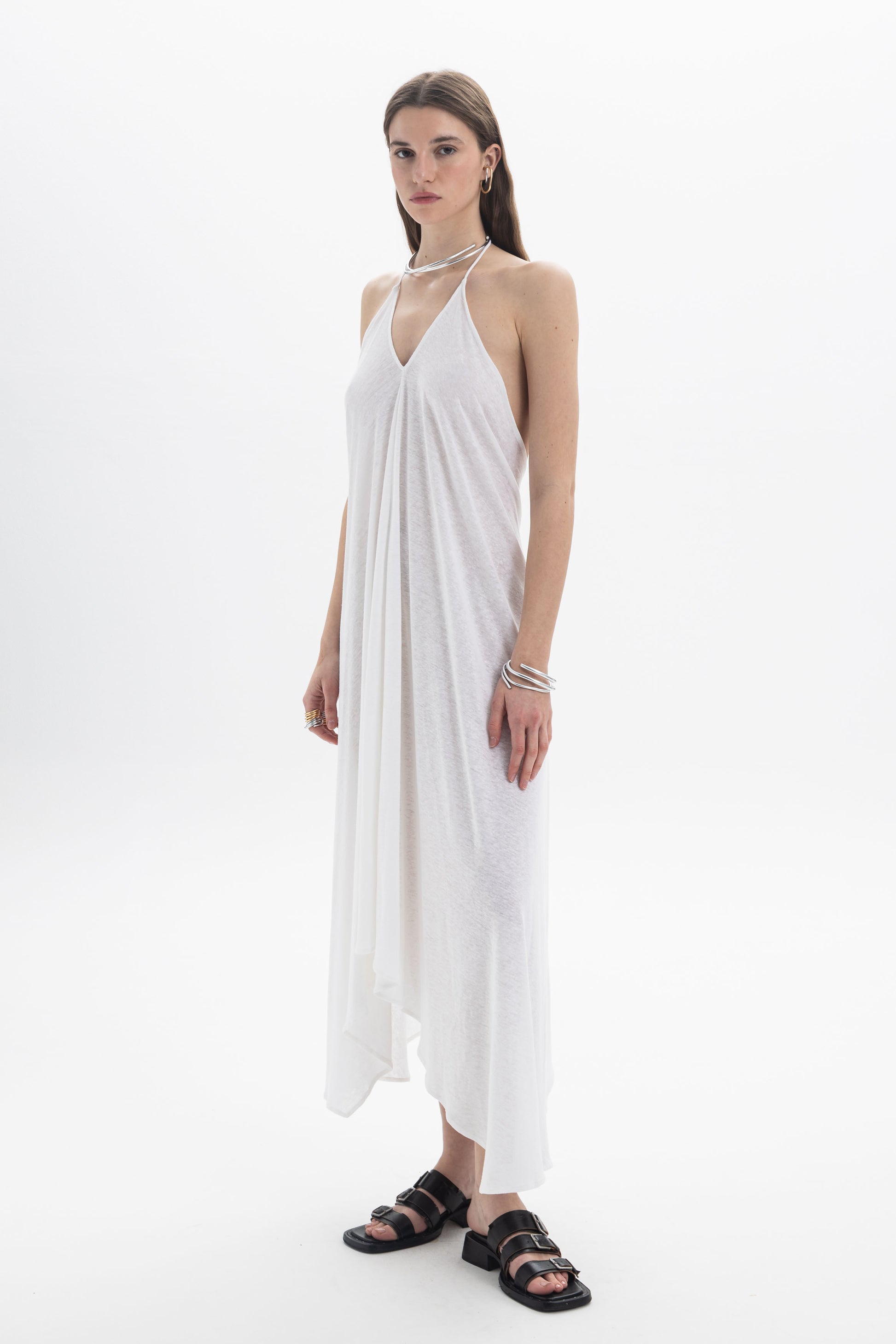 B&B x F Halter Asymmetric Dress on a model, featuring a deep V neckline and open back with a flowing silhouette.