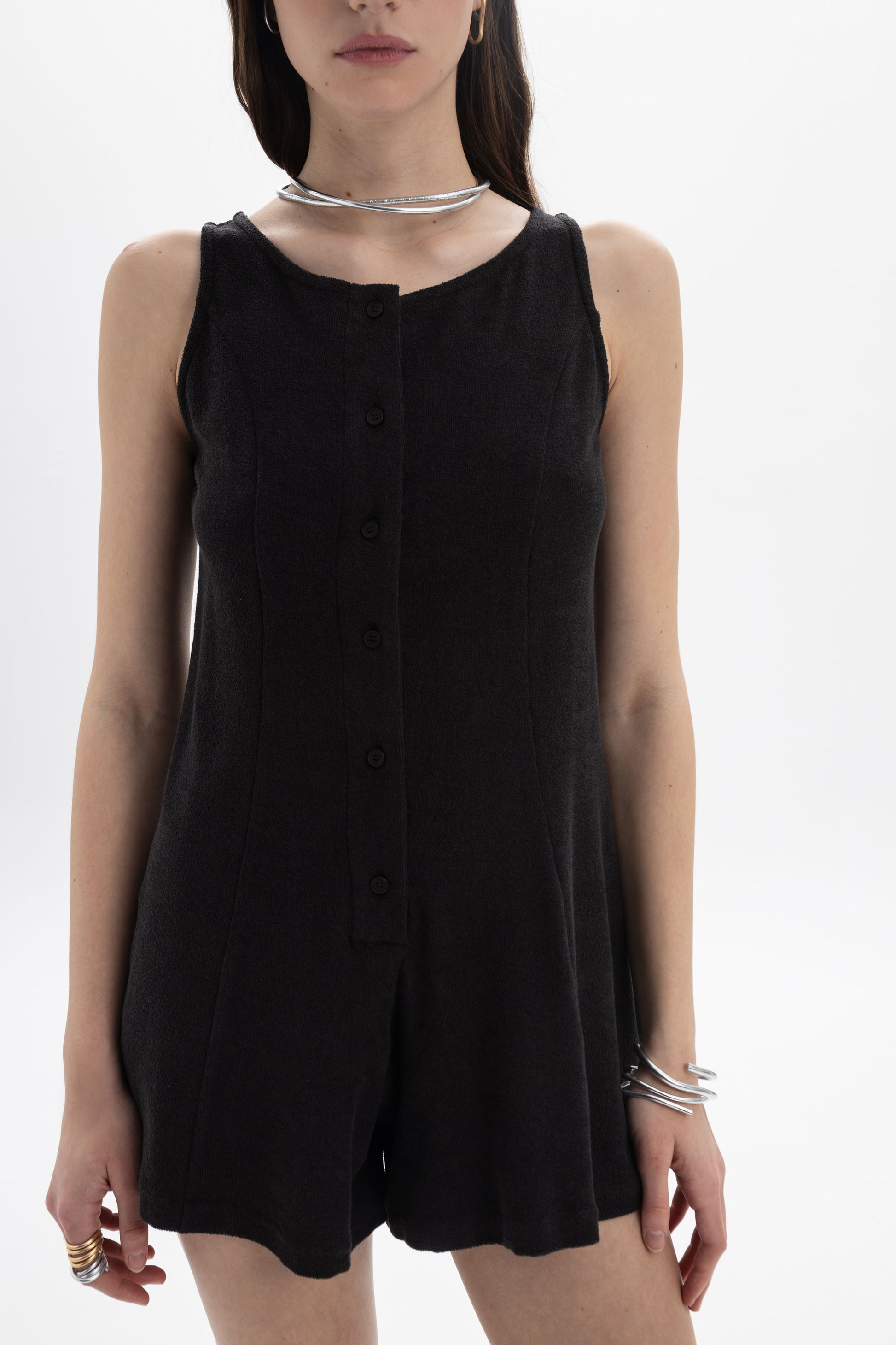 B&B x F Button Front Romper featuring a sleeveless design and button-front detail in black.