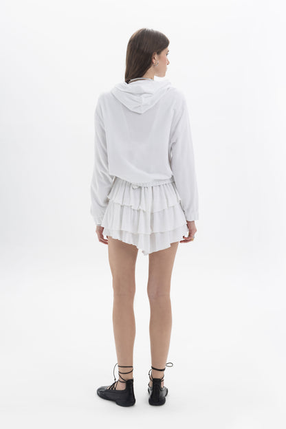 B&B x F Zip Hooded Jacket in white, showcasing a relaxed fit with tiered ruffle hem and a back view.