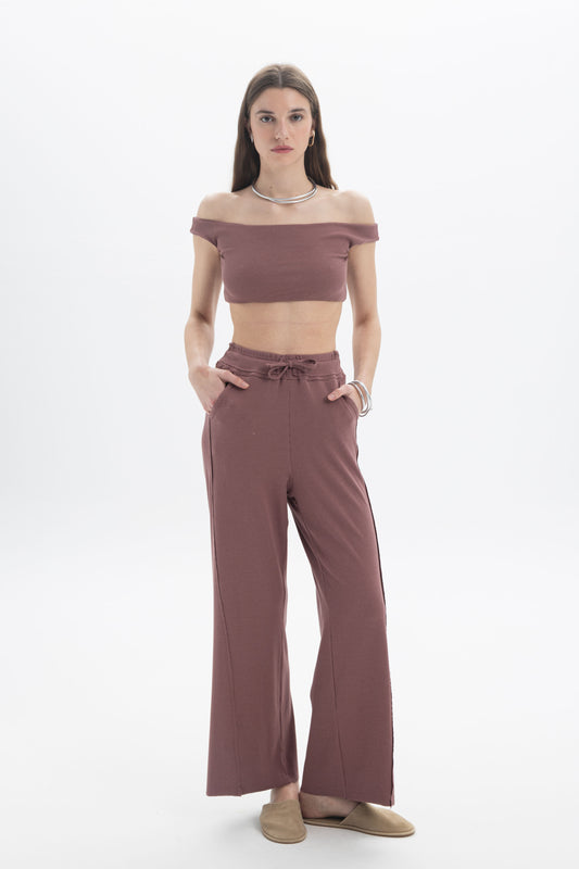 B&B x F Off-Shoulder Crop Top worn with matching relaxed pants, showcasing a fitted silhouette and clean neckline.