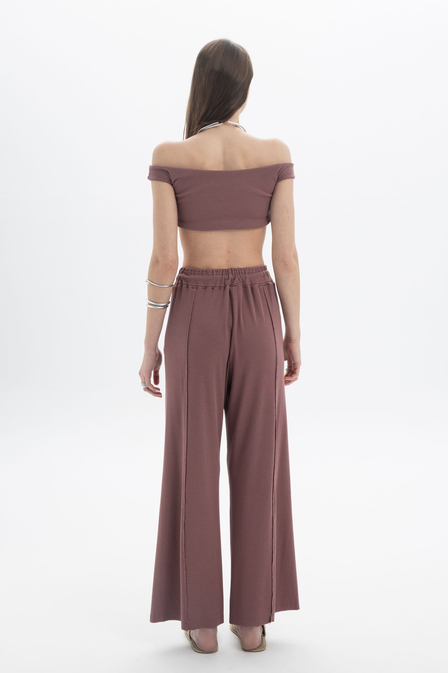 Model wearing the B&B x F Off-Shoulder Crop Top with high-waisted pants, showcasing a modern and minimal look.