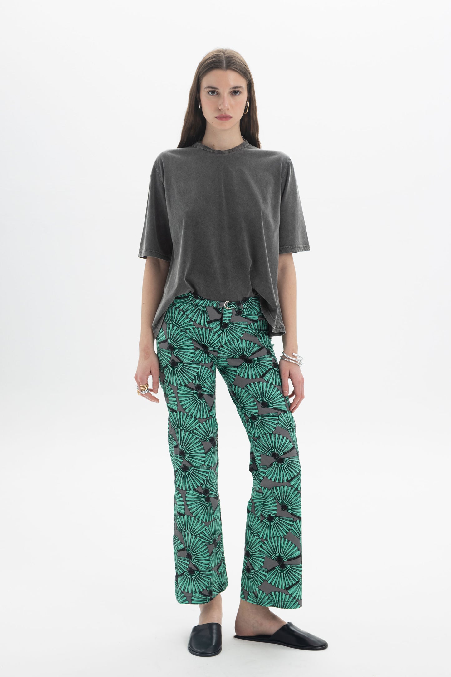 Model wearing B&B x F Washed Relaxed T-Shirt with green patterned pants, showcasing a casual style.