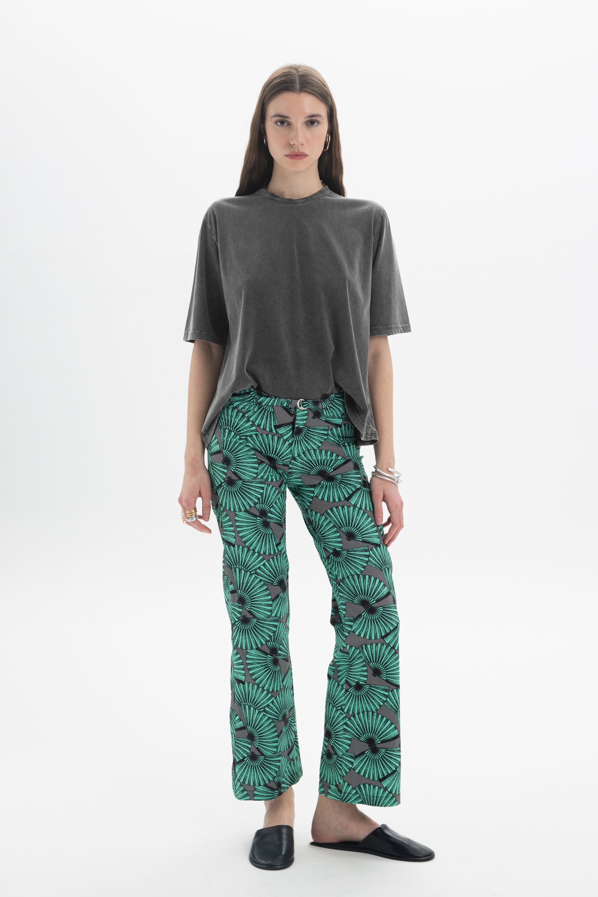 Model wearing B&B x F Washed Relaxed T-Shirt with green patterned pants, showcasing a casual style.