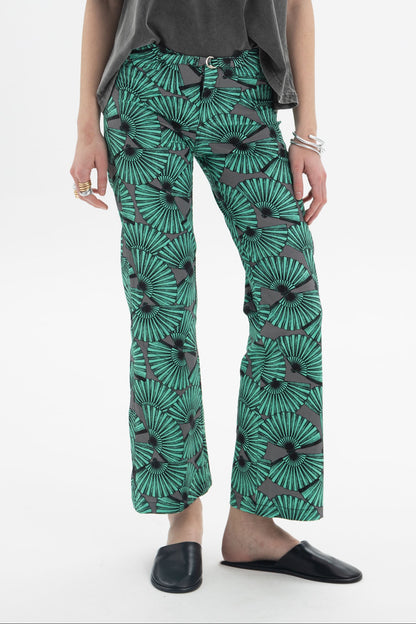 Model wearing Graphic Print Cropped Pants with a bold fan-inspired print and straight silhouette.