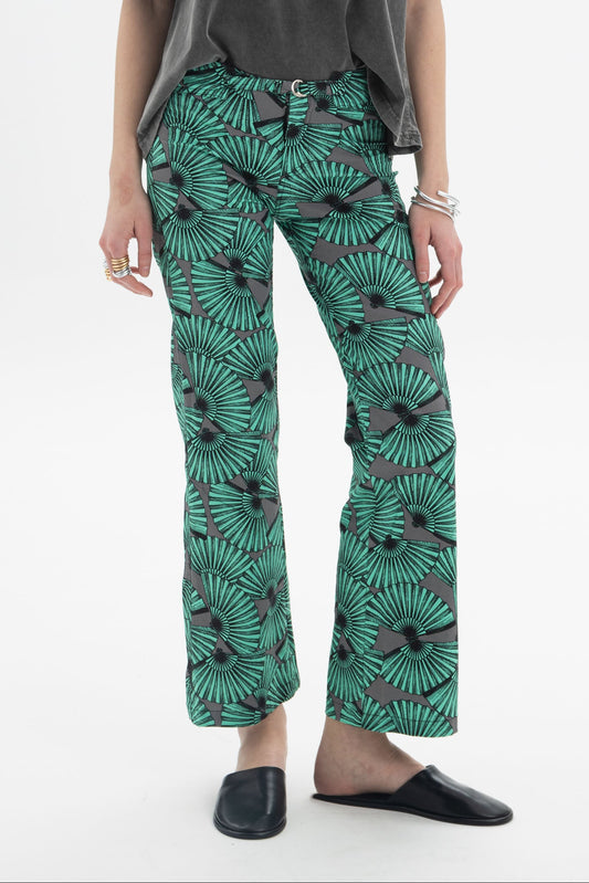 Model wearing Graphic Print Cropped Pants with a bold fan-inspired print and straight silhouette.