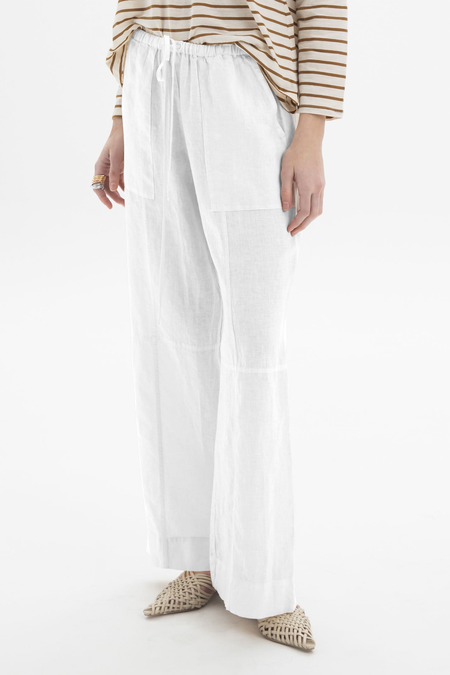 Black and Black linen drawstring wide-leg pants with relaxed fit, shown on a model against a neutral background.