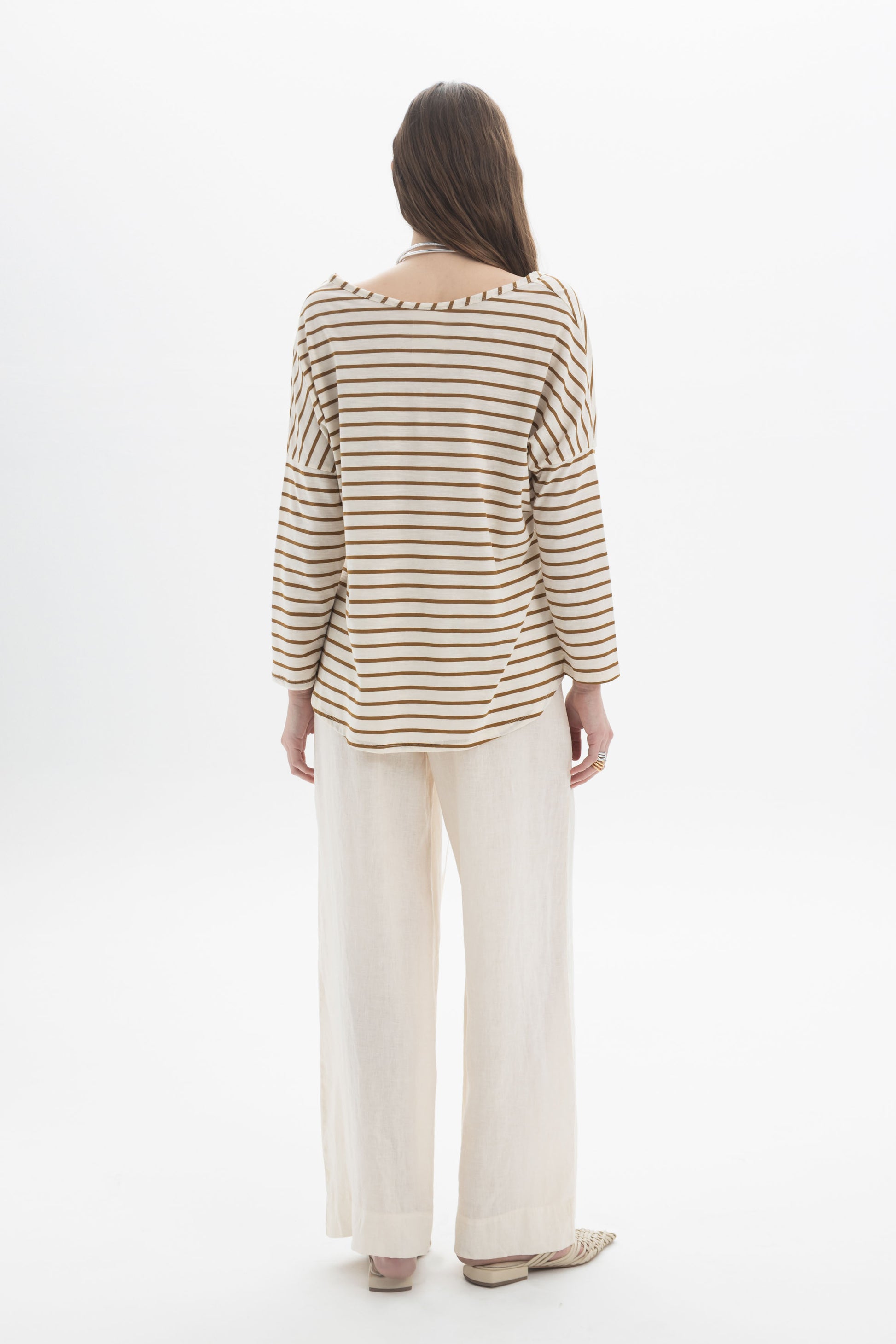 Back view of a model wearing the B&B x F Striped Relaxed Top with relaxed pants, showcasing the soft boat neckline and dropped shoulders.