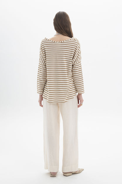 Back view of a model wearing the B&B x F Striped Relaxed Top with relaxed pants, showcasing the soft boat neckline and dropped shoulders.