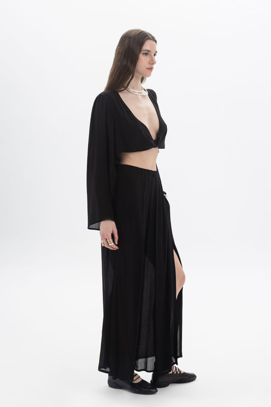 Model wearing Wide Leg Sheer Pants with a cropped top, showcasing the relaxed fit and semi-sheer fabric.